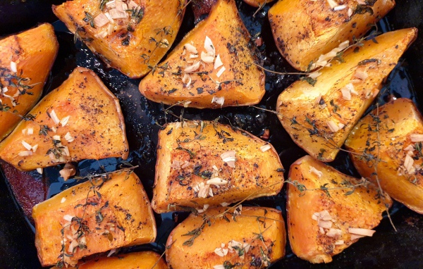 Pieces of fried pumpkin with spices in a pan