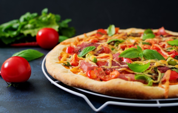 Appetizing pizza with bacon and rosemary