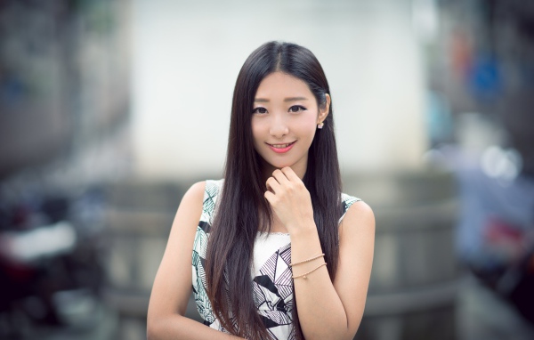 Cute long-haired Asian girl with a beautiful smile