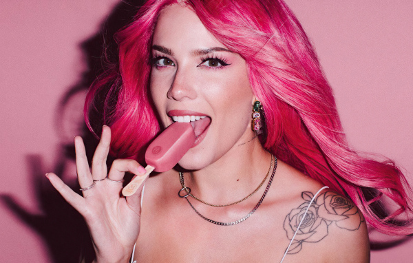 Singer Halsey Magnum with pink hair with ice cream in her hand
