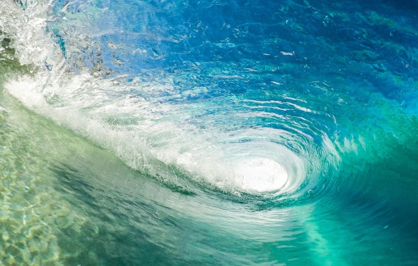 Big wave for surfing in the blue ocean