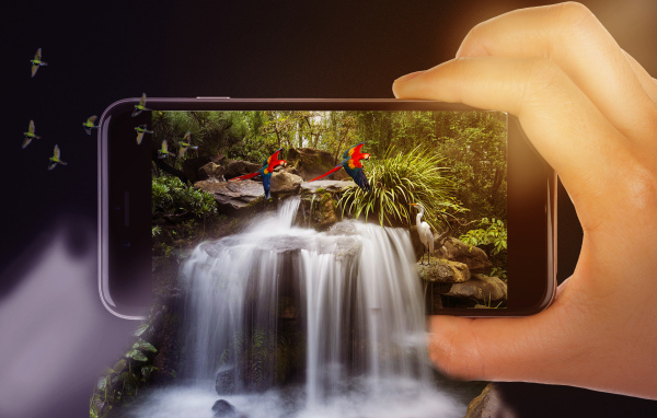Waterfall flows from a smartphone in a hand