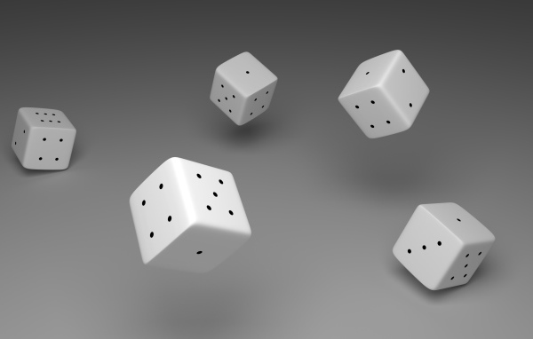 Белые игральные кости в воздухе на сером фоне