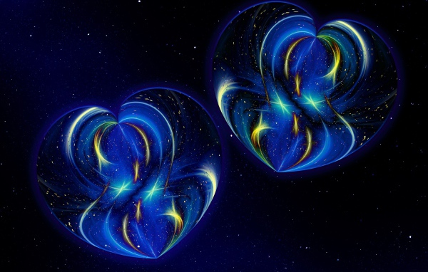 Два красивых неоновых сердца на синем фоне