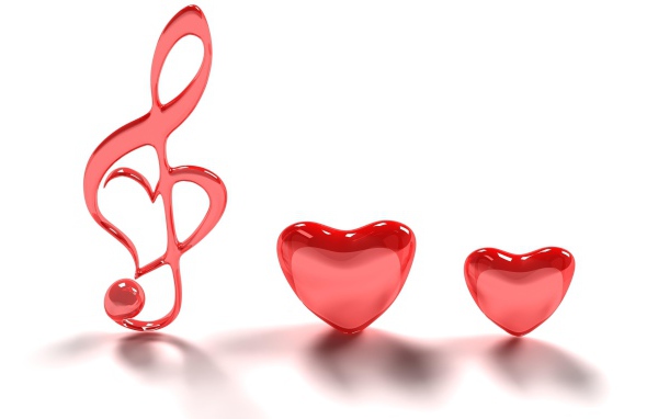 Два красных сердца и нотный знак на белом фоне