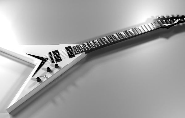 Белая электрогитара на сером фоне 