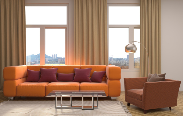 Большой оранжевый диван с подушками у окна 