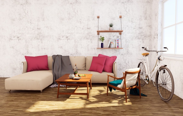 Диван и велосипед стоят в комнате