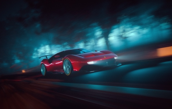 Красный автомобиль Ferrari P80C на трассе