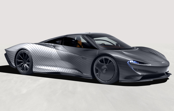 Серебристый McLaren MSO Speedtail Albert Hommage на сером фоне 