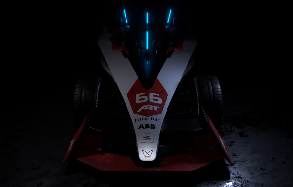 Гоночный автомобиль ABT Sportsline Mahindra M9Electro 2022 на черном фоне