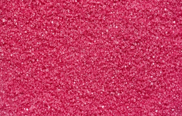 Мелкий розовый сахар для фона
