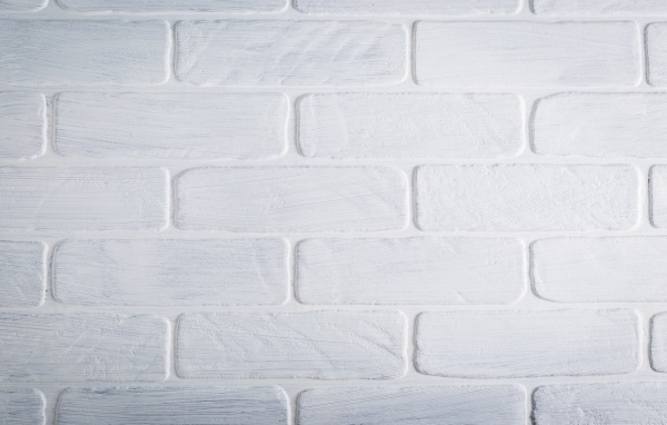 Белая кирпичная стена крупным планом