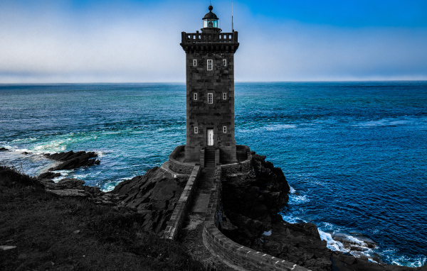 Large stone lighthouse on the coast of France