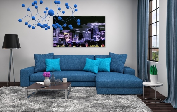 Большой синий диван в комнате в стиле модерн