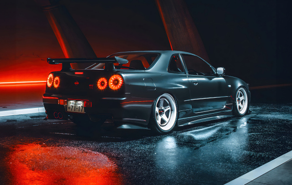 Черный автомобиль Nissan Skyline GTR R35 вид сзади