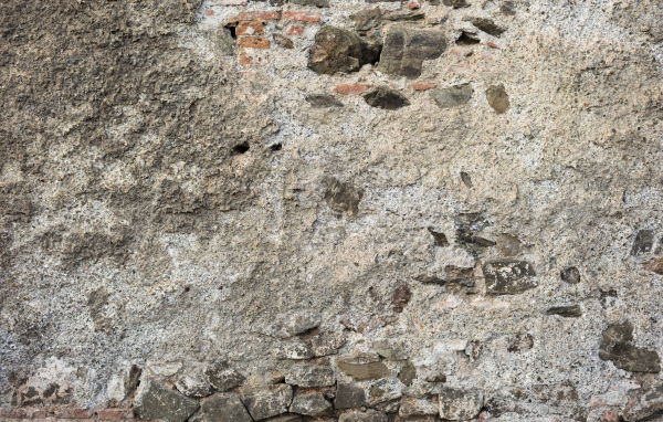 Старая текстурированная стена из цемента и кирпича для фона