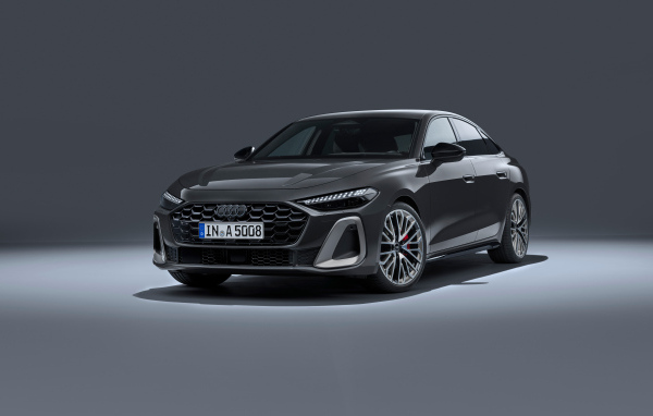 Автомобиль Audi A5 TFSI quattro S line 2024 года на сером фоне