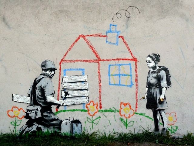 Volunteers Painting Banksy