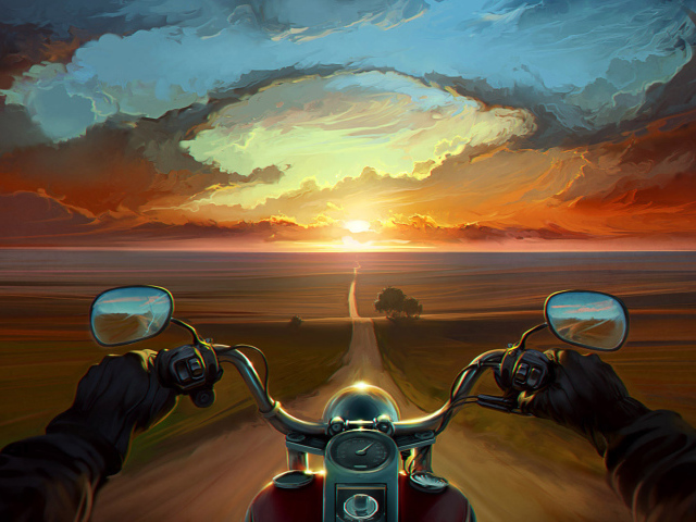 Мотоциклист едет на закат