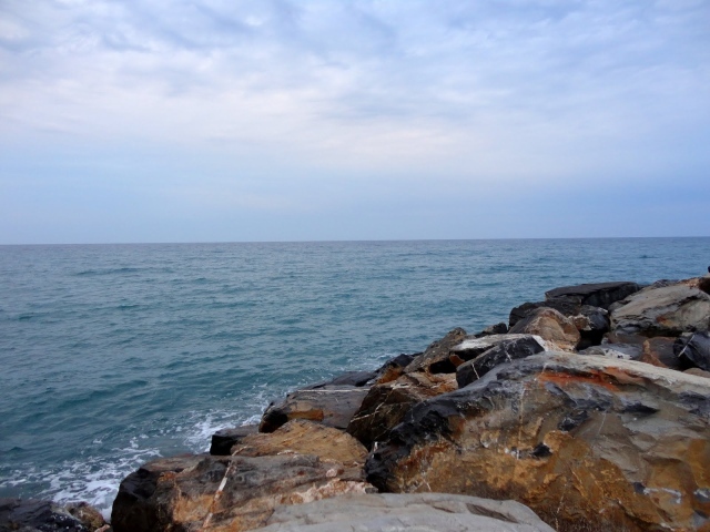 Rocky shore at the resort of Diano Marina, Italy