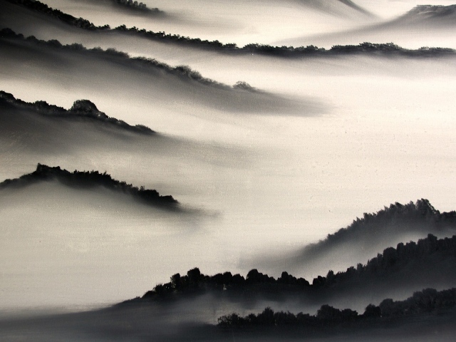 Hills in dense fog