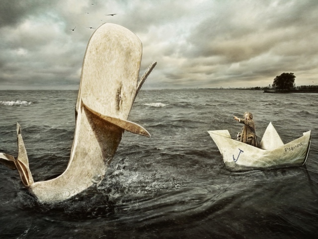 A man in a paper boat and whale