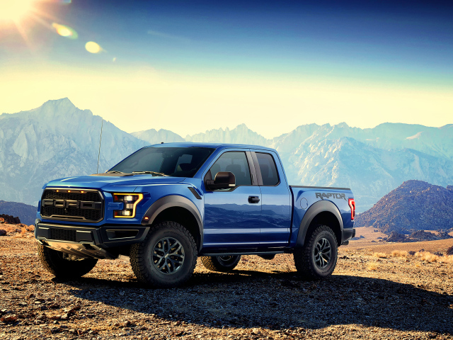 Blue pickup Ford F-150 Raptor, 2017 amid the mountains