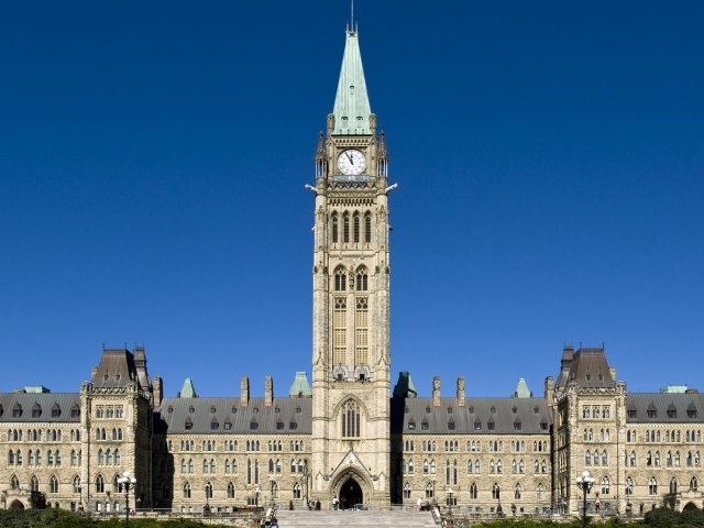 An old parliament building under a blue sky, Canada