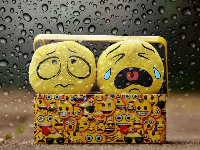 Yellow sad emoticons in the box