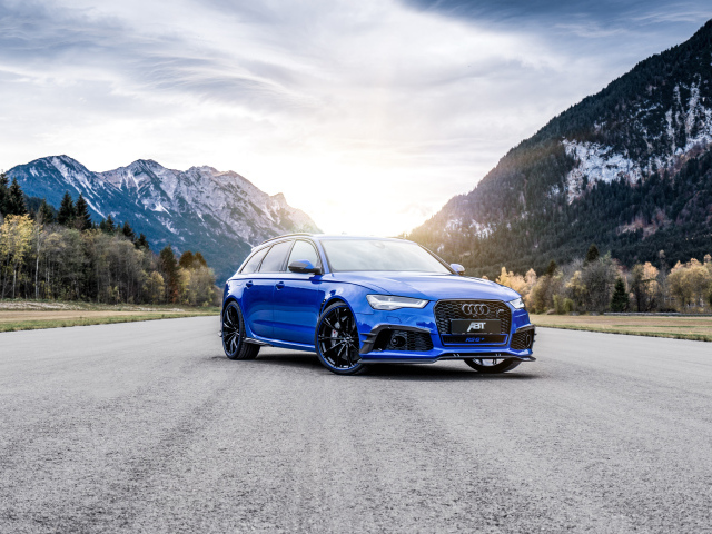 Blue Audi RS 6 on the background of mountains on the road