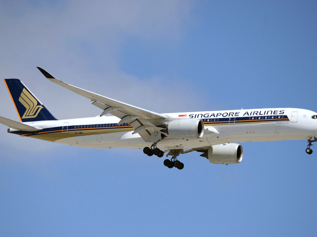 Singapore Airlines airplane in the blue sky