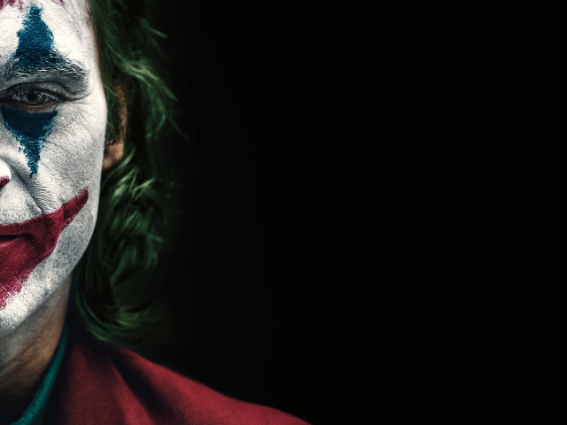 Joker movie poster on a black background, 2019