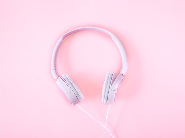 Pink big headphones on a pink background