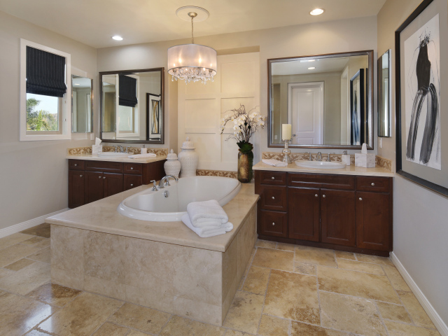 Large white bathroom with mirrors