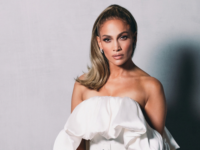Popular Actress And Singer Jennifer Lopez On A Gray Background
