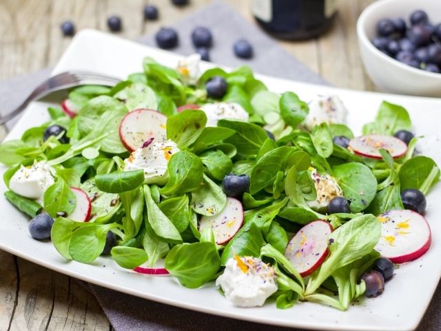 Salad with radish, basil, cheese and blueberries