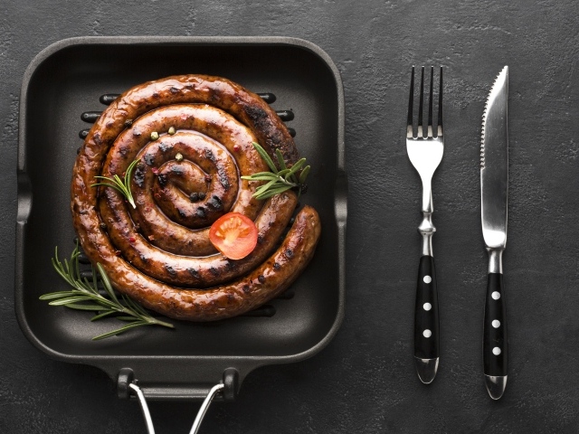 Delicious baked homemade sausage in a pan