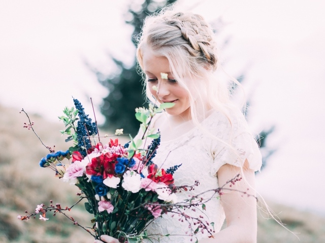 Beautiful girl bride with a wedding bouquet in her hands