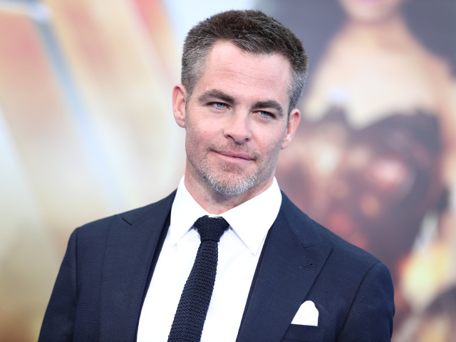Handsome blue-eyed actor Chris Pine in a suit