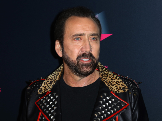 Blue-eyed actor Nicolas Cage in a leather jacket
