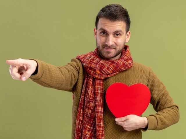 Man with a red heart in his hand