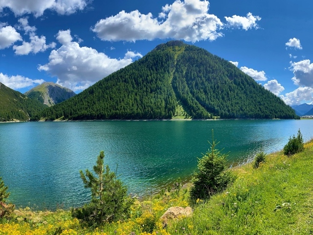 Reservoir Lago di Livigno near the mountains, Italy