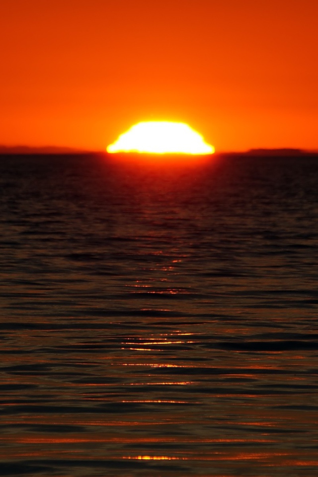 A large sun at sunset