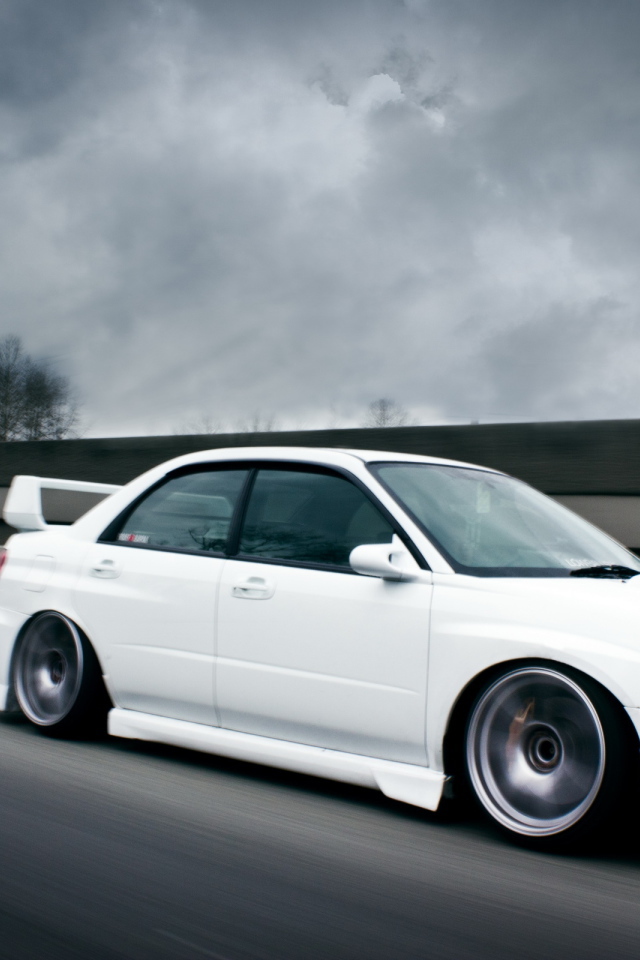white Subaru Impreza STI