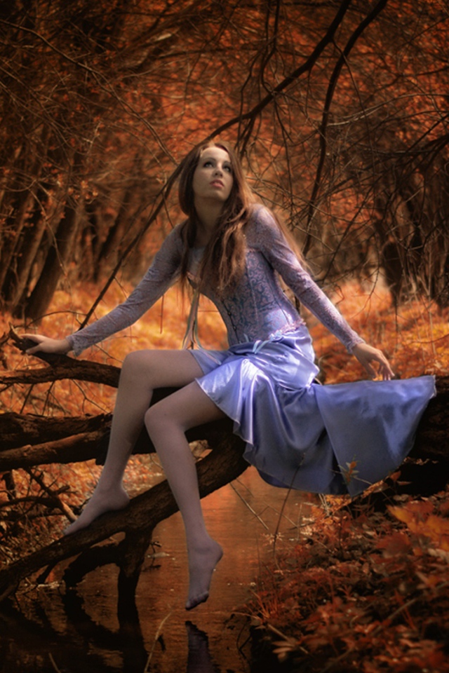 Girl in autumn forest