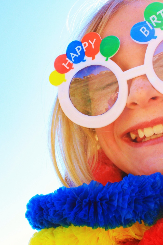 Girl in funny glasses on birthday