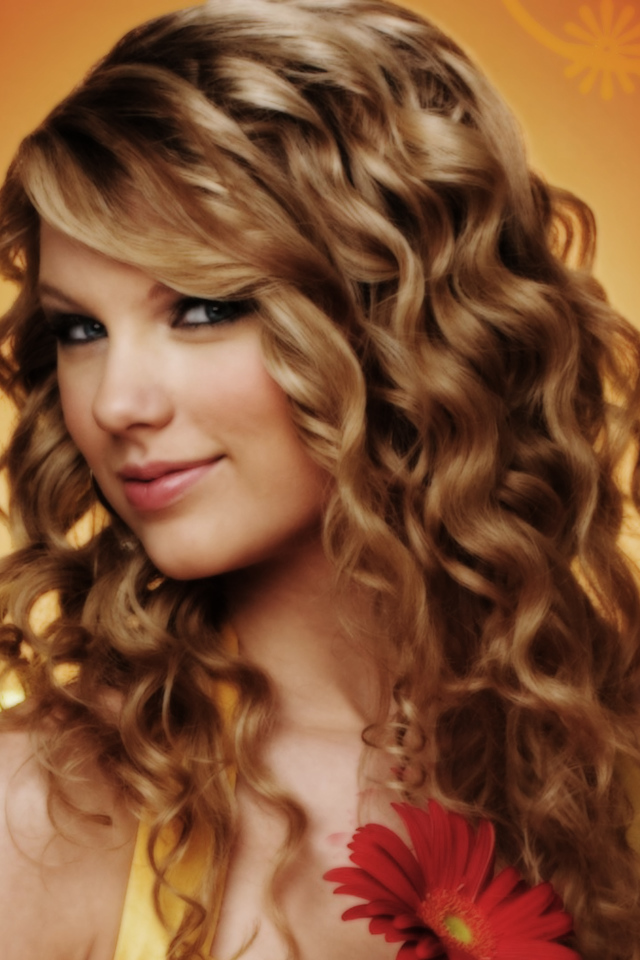 Taylor Swift в оранжевом фоне