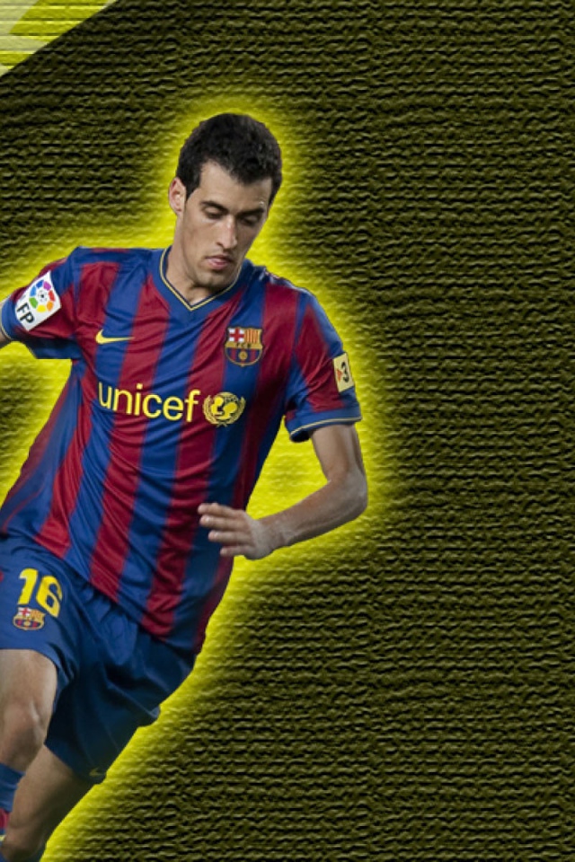 The football player of Barcelona Sergio Busquets on yellow background