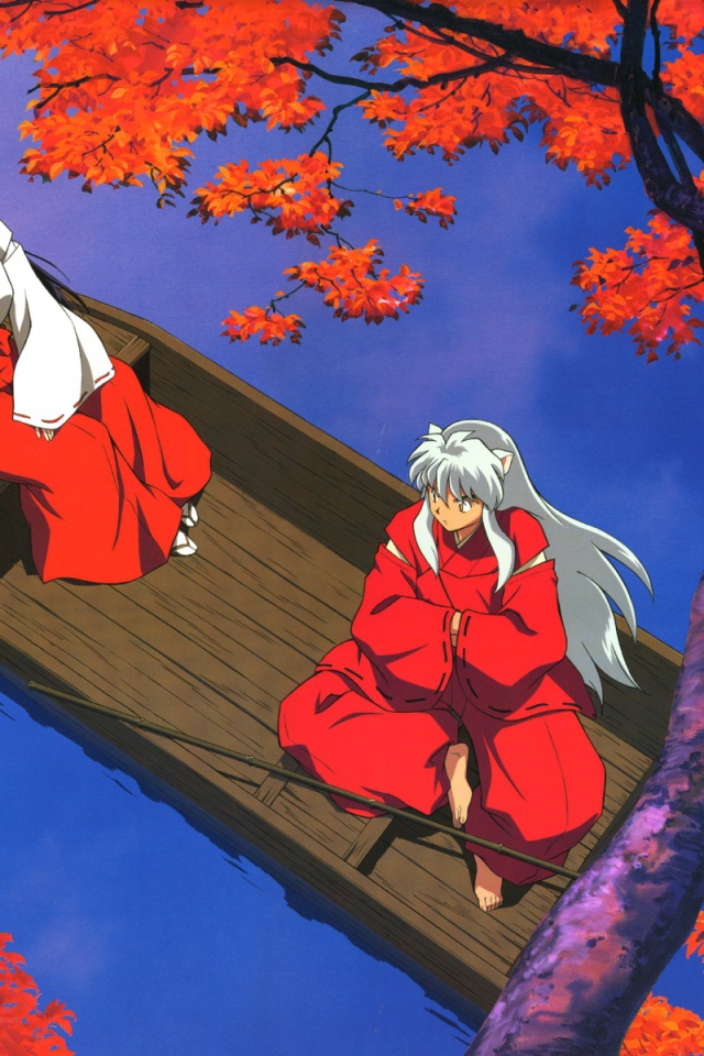 Две девочки в лодке осенью